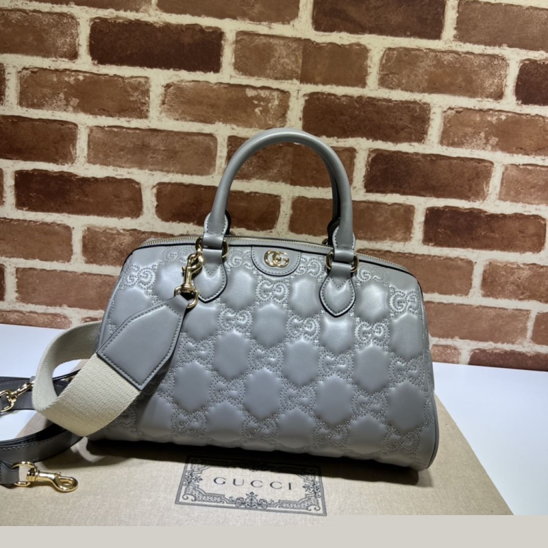 G*u*i top handle bags